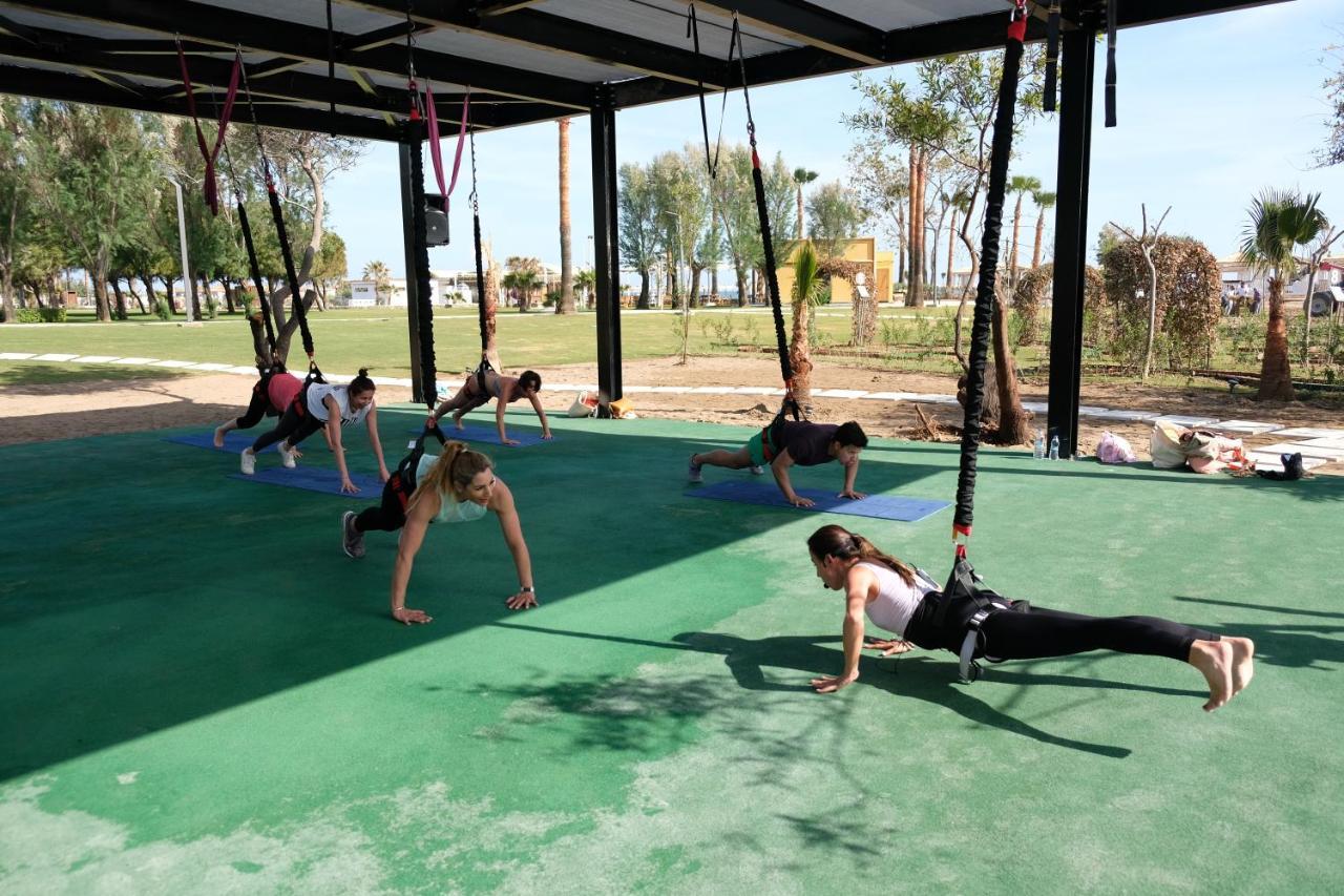 Lara Barut Collection Hotel Анталия Екстериор снимка A group of women doing yoga at the park